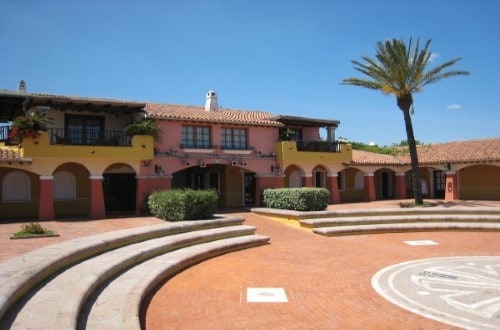 Hotel entrance at Liscia Eldi Resort in San Teodoro, Sardinia. Travel with World Lifetime Journeys