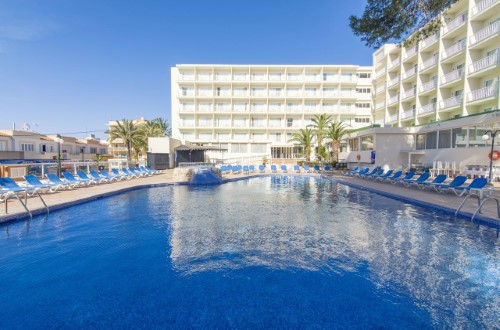 Hotel pool at Azuline Hotel Coral Beach in Es Canar, Ibiza. Travel with World Lifetime Journeys