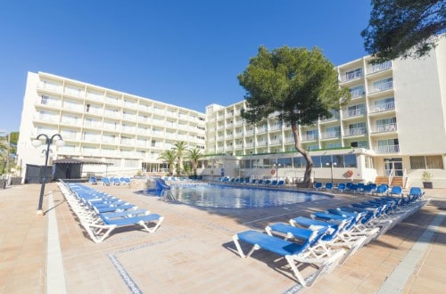 Hotel pool at Azuline Hotel Coral Beach in Es Canar, Ibiza. Travel with World Lifetime Journeys