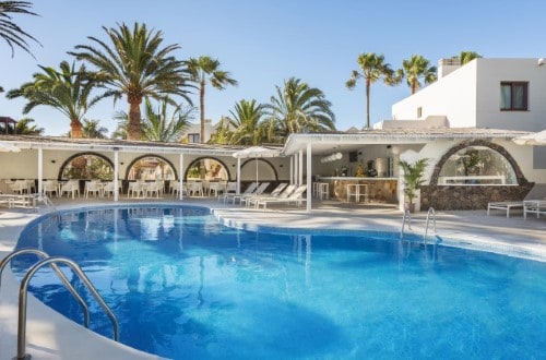 Pool side at Suite Hotel Atlantis Fuerteventura Resort, Corralejo. Travel with World Lifetime Journeys