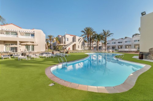 Hotel pool at The Koala Garden Suites in Maspalomas, Gran Canaria. Travel with World Lifetime Journeys