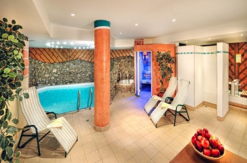 Indoor pool area at Hotel Zum Hirschen in Zell am See, Austria. Travel with World Lifetime Journeys