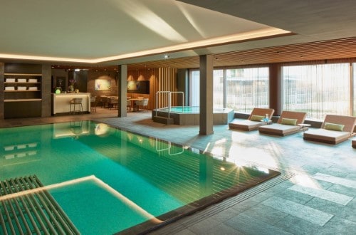 Indoor pool at Hard Rock Hotel Davos, Switzerland. Travel with World Lifetime Journeys