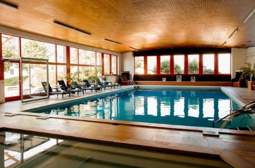 Indoor pool at Hotel Sport Klosters, Switzerland. Travel with World Lifetime Journeys