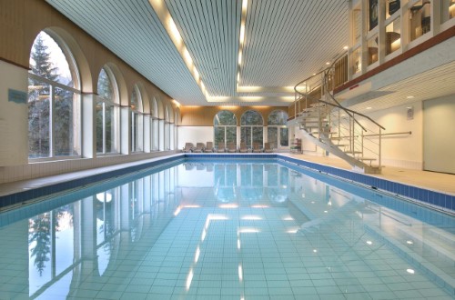 Indoor pool at Hotel Sunstar Arosa, Switzerland. Travel with World Lifetime Journeys