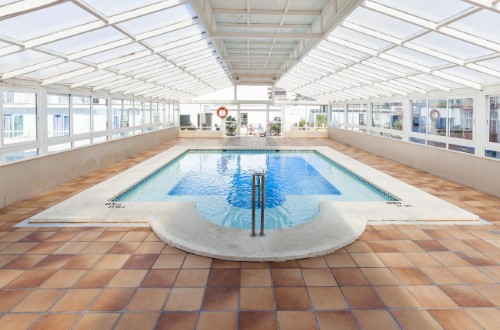 Indoor pool at Port Fiesta Park in Benidorm, Spain. Travel with World Lifetime Journeys