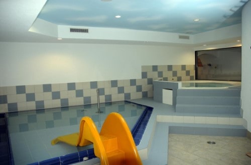 Indoor pool at Saaserhof Hotel in Saas Fee, Switzerland. Travel with World Lifetime Journeys