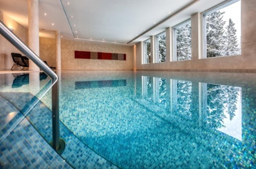 Indoor pool at Waldhotel National Superior Hotel in Arosa, Switzerland. Travel with World Lifetime Journeys