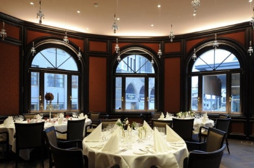 Indoor restaurant at Hotel Schweizerhof in St. Moritz, Switzerland. Travel with World Lifetime Journeys