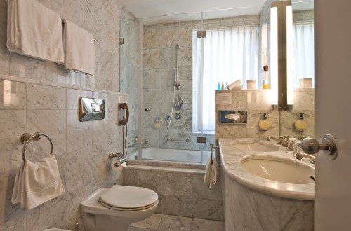 Junior suite ensuite bath at Hotel Schweizerhof in St. Moritz, Switzerland. Travel with World Lifetime Journeys