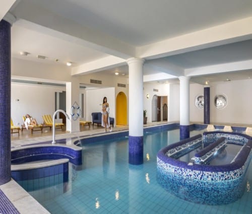 Indoor pool at Aquamare Beach Hotel in Paphos, Cyprus. Travel with World Lifetime Journeys