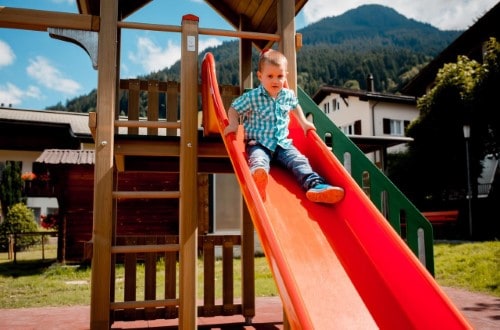 Outdoor kids area at Hotel Sport Klosters, Switzerland. Travel with World Lifetime Journeys