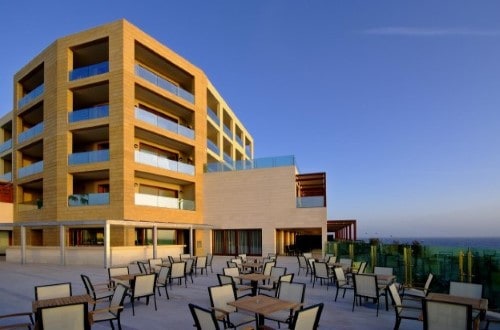 Outdoor terrace at Hotel Carlos V in Alghero, Italy. Travel with World Lifetime Journeys