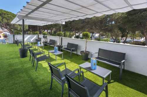 Outdoor terrace at Hotel GHT Sa Riera in Tossa de Mar, Spain. Travel with World Lifetime Journeys