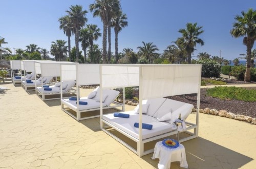 Outside lounges at Cabogata Garden Hotel & Spa in Almeria, Spain. Travel with World Lifetime Journeys