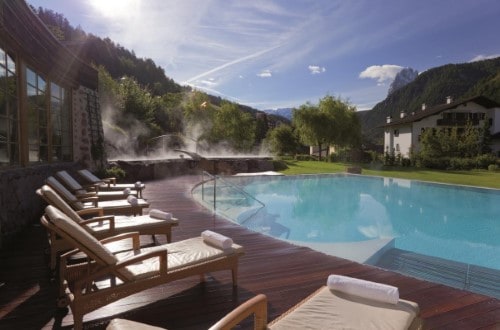 Outside pool at Hotel Adler Dolomiti in Ortisei, Italy. Travel with World Lifetime Journeys