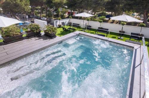 Outside pool at Hotel GHT Sa Riera in Tossa de Mar, Spain. Travel with World Lifetime Journeys