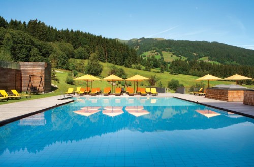 Outside pool at Kempinski Hotel Das Tirol in Kitzbühel, Austria. Travel with World Lifetime Journeys