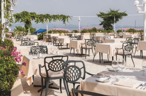 Outside terrace at Corfu Holiday Palace in Corfu, Greece. Travel with World Lifetime Journeys