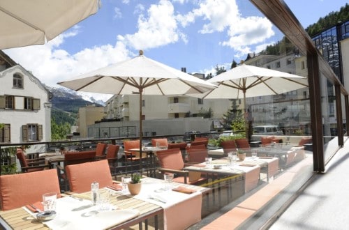 Outside terrace restaurant at Hotel Schweizerhof in St. Moritz, Switzerland. Travel with World Lifetime Journeys