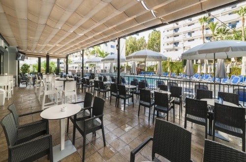 Outside terrace at Hotel Los Patos Park in Benalmadena, Spain. Travel with World Lifetime Journeys