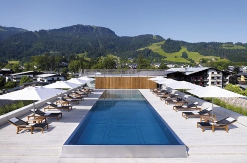 Pool area at Hotel Schwarzer Adler in Kitzbühel, Austria. Travel with World Lifetime Journeys