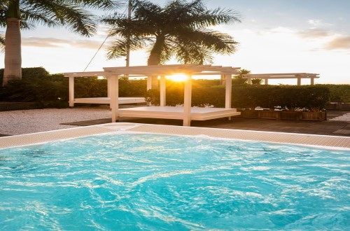 Pool lounges at Marina Suites in Puerto Rico, Gran Canaria. Travel with World Lifetime Journeys