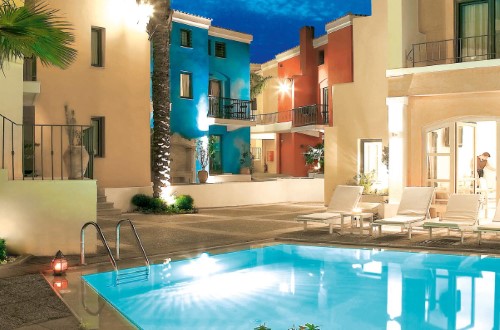 Pool side at Grecotel Plaza Spa Apartments in Rethymno, Crete. Travel with World Lifetime Journeys