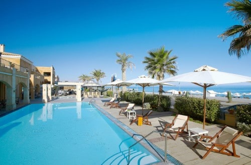 Pool side at Grecotel Plaza Spa Apartments in Rethymno, Crete. Travel with World Lifetime Journeys