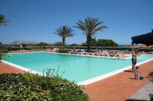 Pool side at Liscia Eldi Resort in San Teodoro, Sardinia. Travel with World Lifetime Journeys