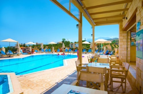 Pool side at Lofos Apartments in Crete, Greece. Travel with World Lifetime Journeys