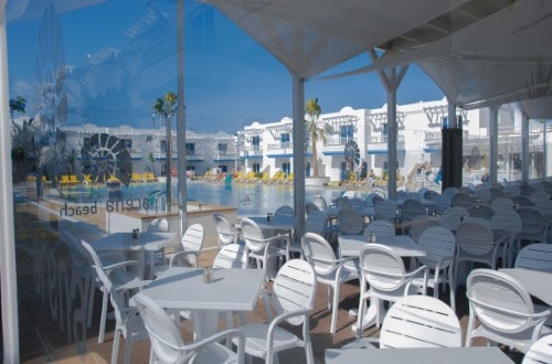 Pool terrace at Arena Beach Apartments in Corralejo, Fuerteventura. Travel with World Lifetime Journeys