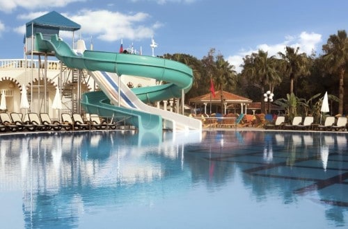 Pool with waterslide at Letoonia Golf Resort in Belek, Antalya. Travel with World Lifetime Journeys