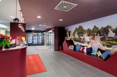 Reception area at Meininger Hotel Downtown Sissi in Vienna, Austria. Travel with World Lifetime Journeys