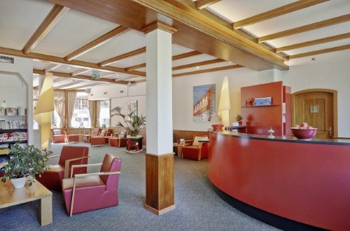 Reception area at Sorell Hotel Asora in Arosa, Switzerland. Travel with World Lifetime Journeys