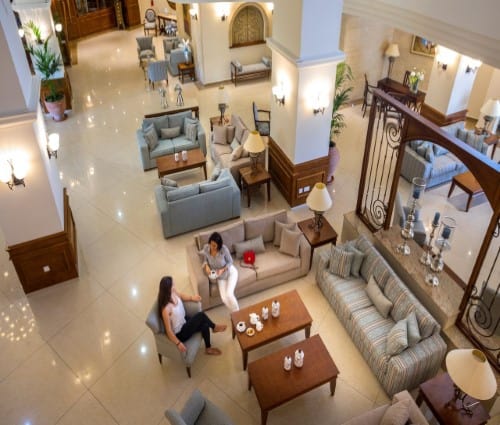 Lounge area at Aquamare Beach Hotel in Paphos, Cyprus. Travel with World Lifetime Journeys