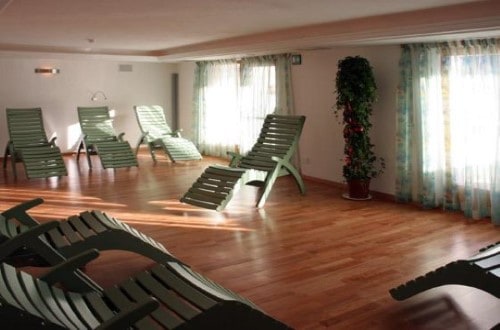 Relaxing room at Garni Bracun Hotel in Corvara, Italy. Travel with World Lifetime Journeys