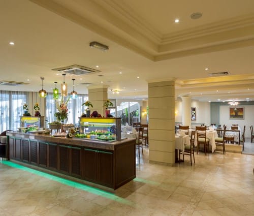 Restaurant area at Aquamare Beach Hotel in Paphos, Cyprus. Travel with World Lifetime Journeys