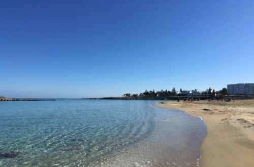 Beach side at Adelais Bay Hotel in Protaras, Cyprus. Travel with World Lifetime Journeys