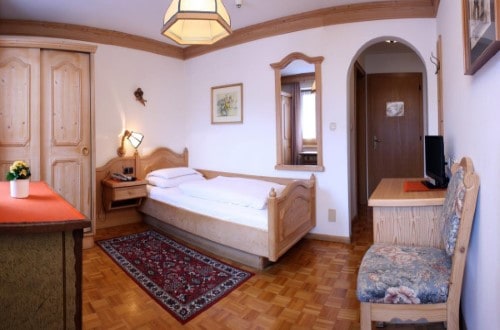 Single room at Hotel Dolomiti Madonna in Ortisei, Italy. Travel with World Lifetime Journeys