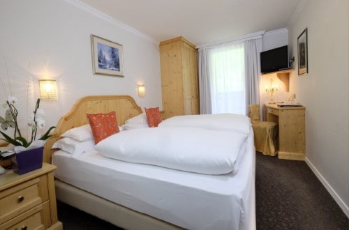 Standard double room at Hotel Evaldo in Arabba, Italy. Travel with World Lifetime Journeys