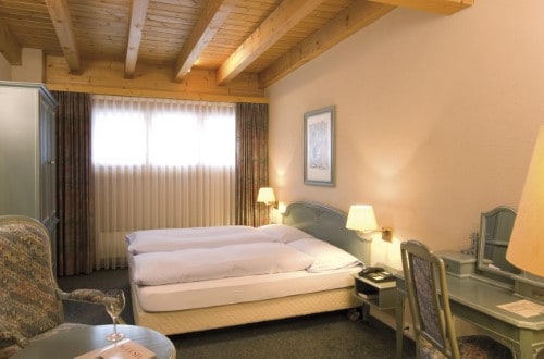 Standard room at Silvretta Parkhotel in Klosters, Switzerland. Travel with World Lifetime Journeys