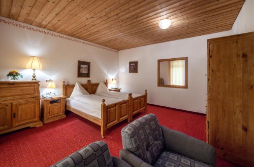 Standard room at Waldhotel National Superior Hotel in Arosa, Switzerland. Travel with World Lifetime Journeys