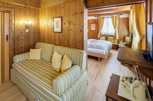 Suite at Chalet Hotel Parc Victoria in Cortina D’Ampezzo, Italy. Travel with World Lifetime Journeys