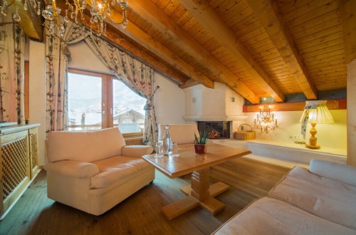 Suite lounge at Hotel Ferienart Resort & Spa in Saas Fee, Switzerland. Travel with World Lifetime Journeys