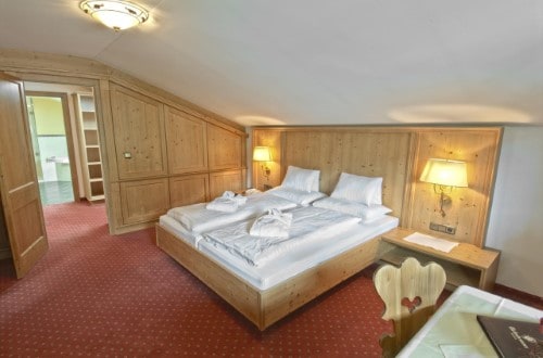 Suite room at Hotel Tiefenbrunner in Kitzbühel, Austria. Travel with World Lifetime Journeys