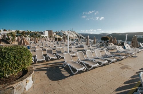 Sun lounges at Servatur Puerto Azul Hotel in Puerto Rico, Gran Canaria. Travel with World Lifetime Journeys