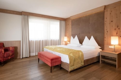 Superior double room at Hotel Adler Dolomiti in Ortisei, Italy. Travel with World Lifetime Journeys