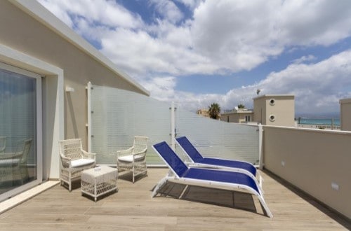 Terrace sun loungers at Hotel Nautilus in Cagliari, Italy. Travel with World Lifetime Journeys