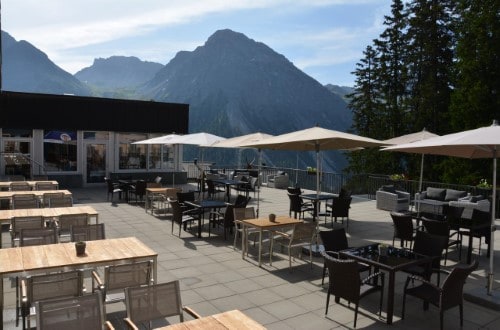 Terrace view at Waldhotel National Superior Hotel in Arosa, Switzerland. Travel with World Lifetime Journeys